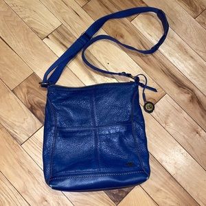 The Sak navy messenger style leather purse